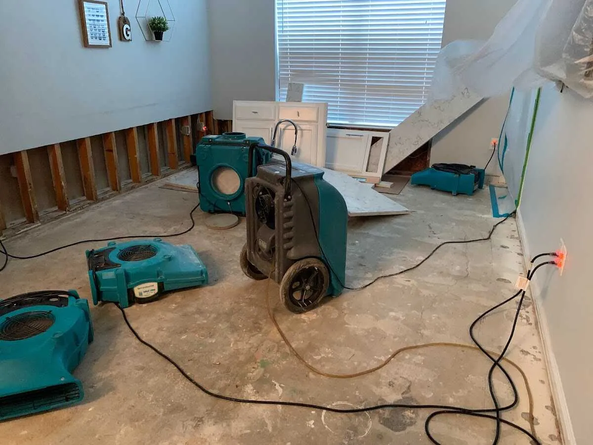 Dehumidifier in flood-cut room for Water Damage Restoration in College Station
